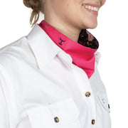 Person wearing a white shirt with a hot pink scarf and floral lining.