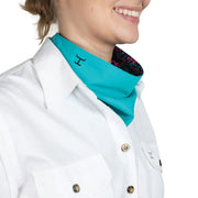 Person wearing a white shirt with a turquoise scarf and floral lining.