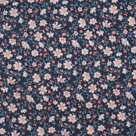 Navy blue fabric with small pink and white floral pattern