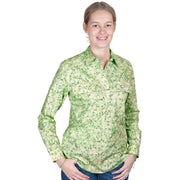 Woman wearing a green floral shirt on a white background