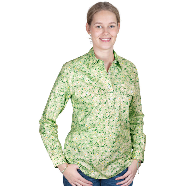 Woman wearing a green floral shirt on a white background