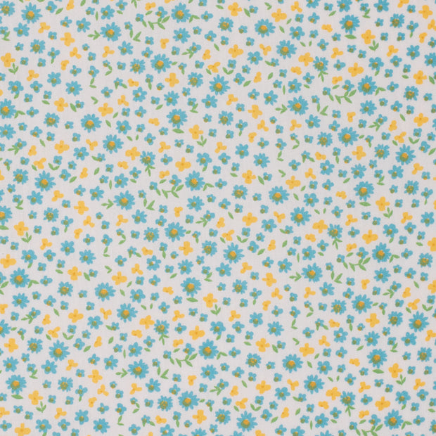 Pattern of small blue and yellow flowers on a light blue background