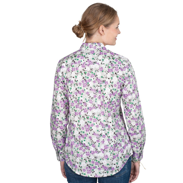 Woman wearing a floral shirt on a white background