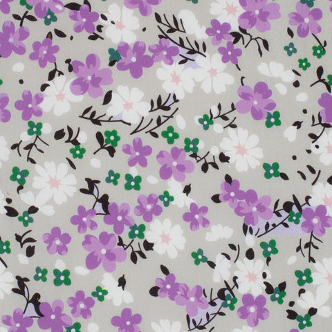 Floral pattern with purple, white, and green flowers on a gray background