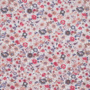 Floral pattern with small flowers in pink, blue, and purple on a light background