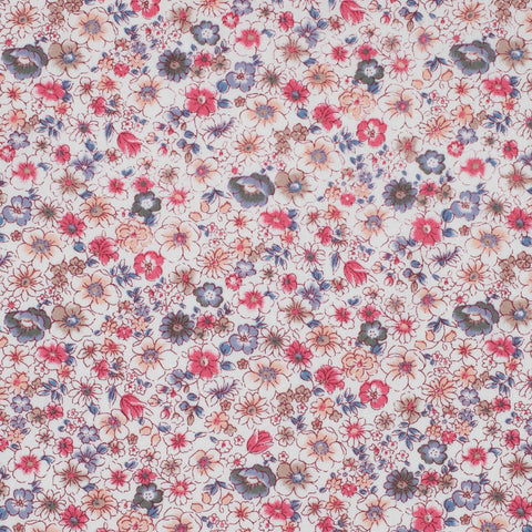 Floral pattern with small flowers in pink, blue, and purple on a light background