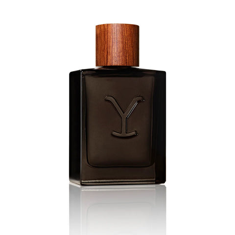 Dark brown perfume bottle with wooden cap on a white background
