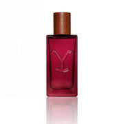 Red perfume bottle with wooden cap on a white background